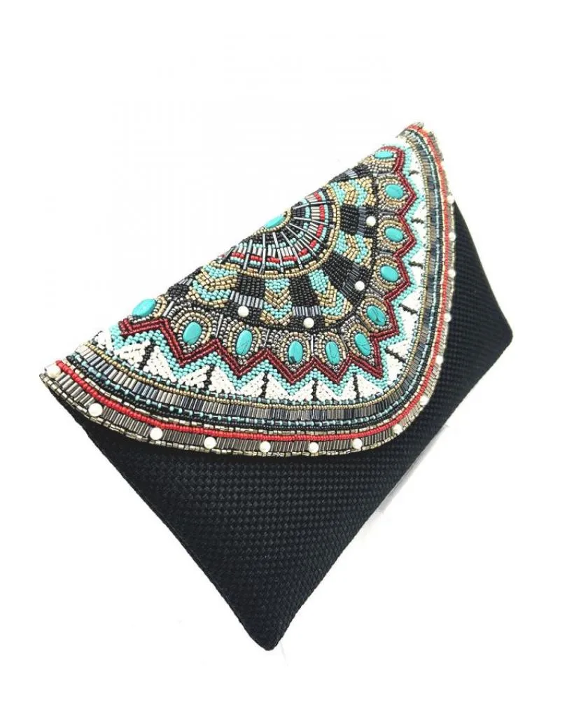 BOLSOS NEGROS CON FABULOSA SOLAPA JOYA DECORADA EN TURQUESA