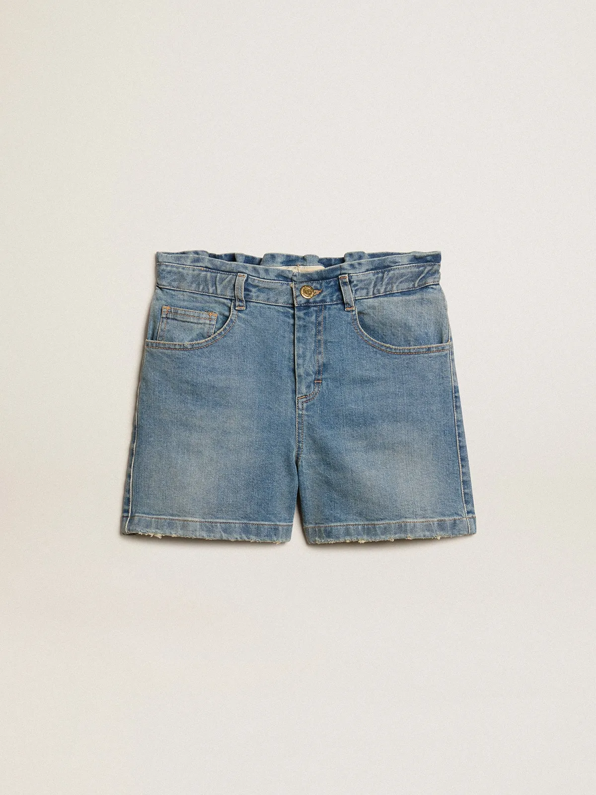 Pantalón corto en tejido vaquero de niña de efecto desgastado