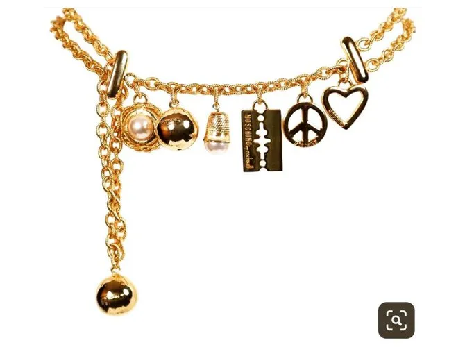 ¡¡raro!! 1990Cinturón con dije dorado de Moschino 